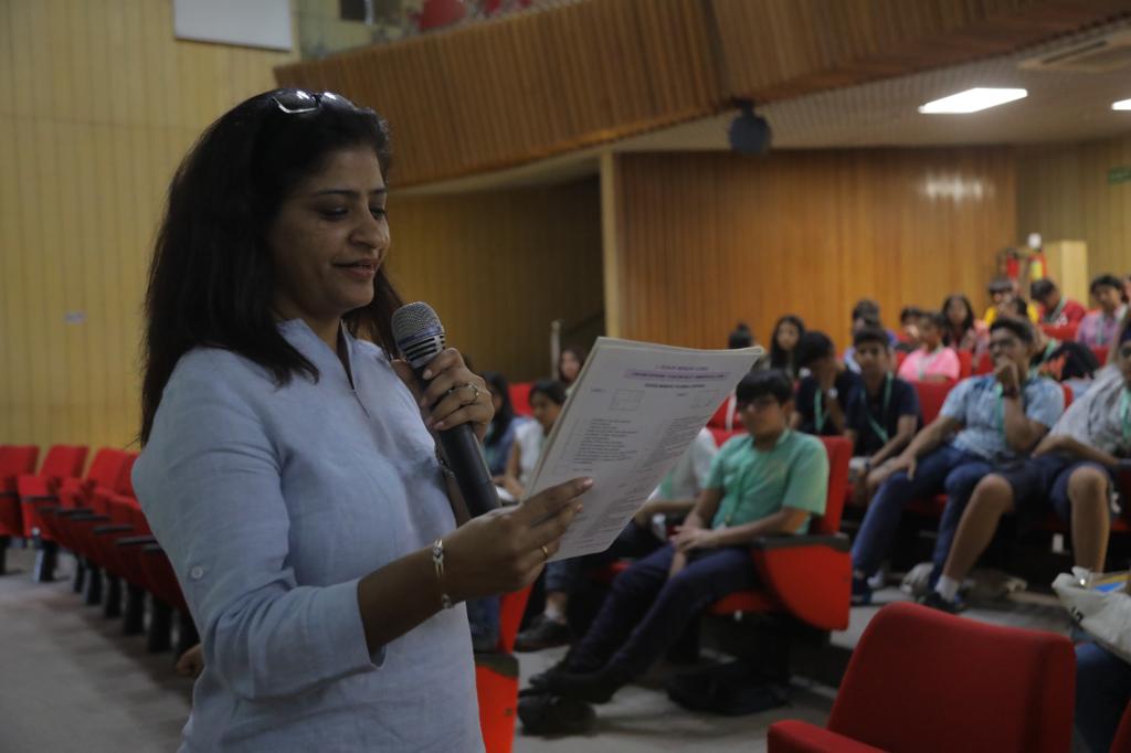 Reena Gupta reading out from a handout as part of an interactive exercise.